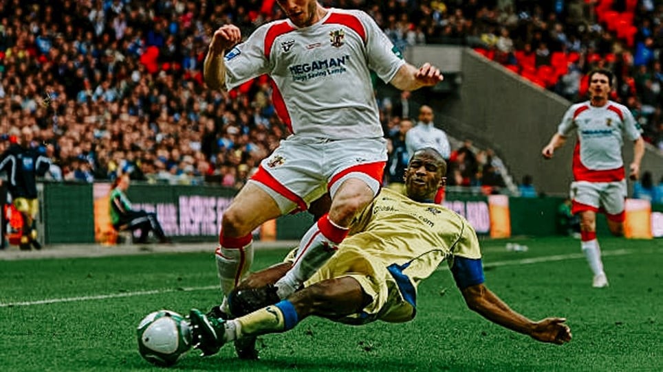 Paul Edwards puts in a tackle against Stevenage Borough in the 2010 FA Trophy Final.