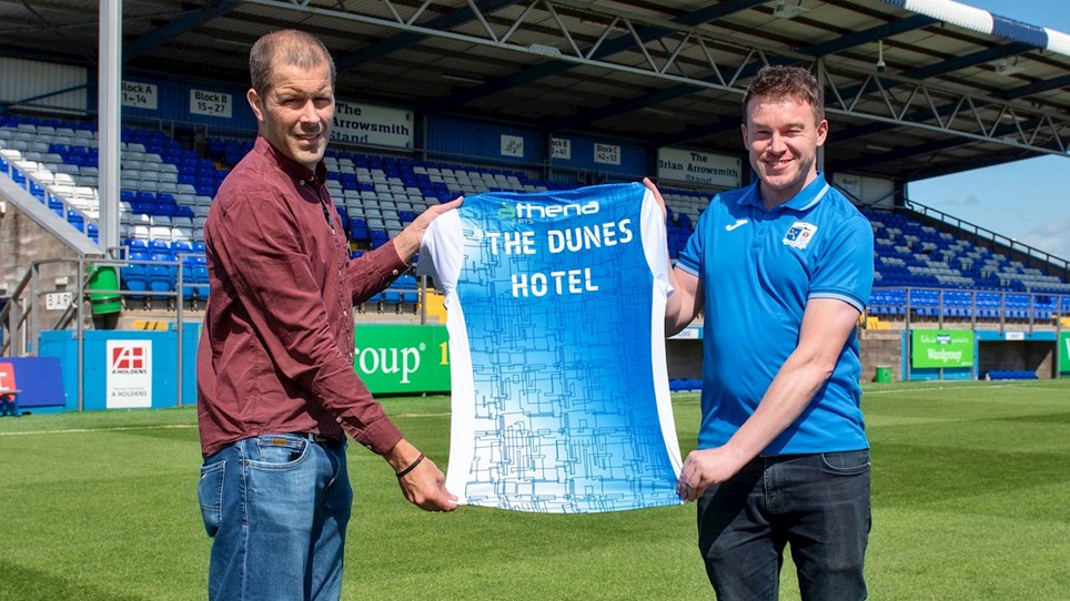 A photograph of Matt Williams of The Dunes Hotel and Jamie Stoddart of Barrow AFC