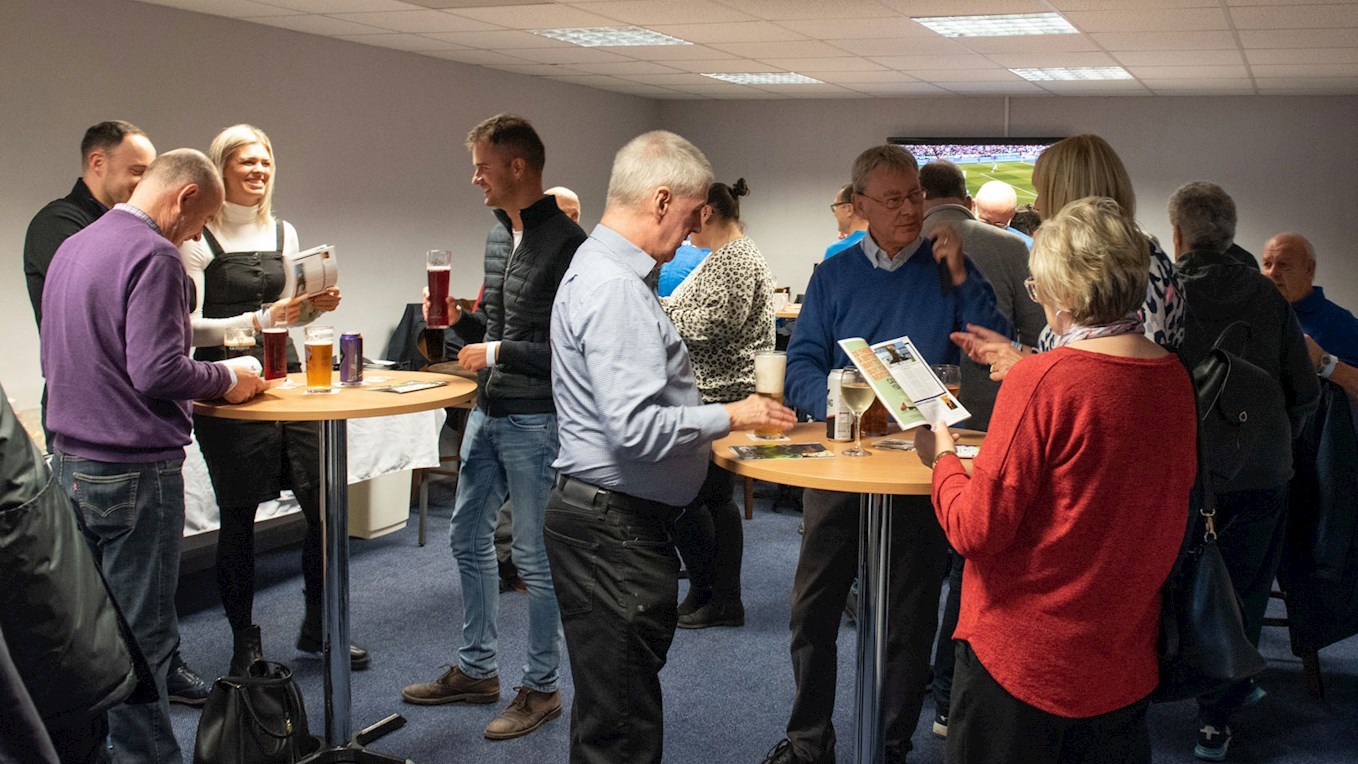 A photograph of Barrow supporters in the corporate hospitality area at The Dunes Hotel Stadium