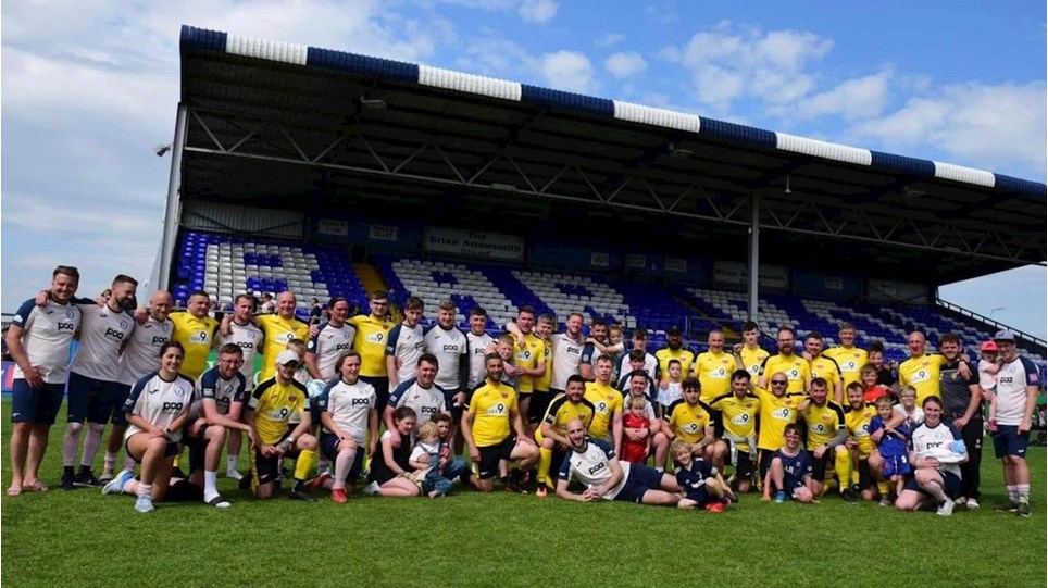 A photograph of the two teams that played in the 24-Hour Charity Match