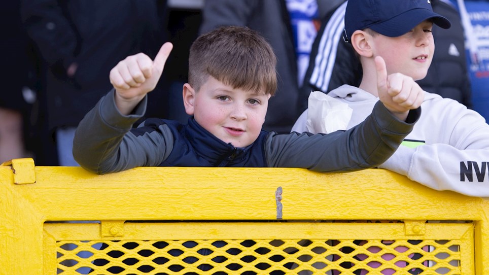 A young supporter cheering Barrow on at The Dunes Hotel Stadium