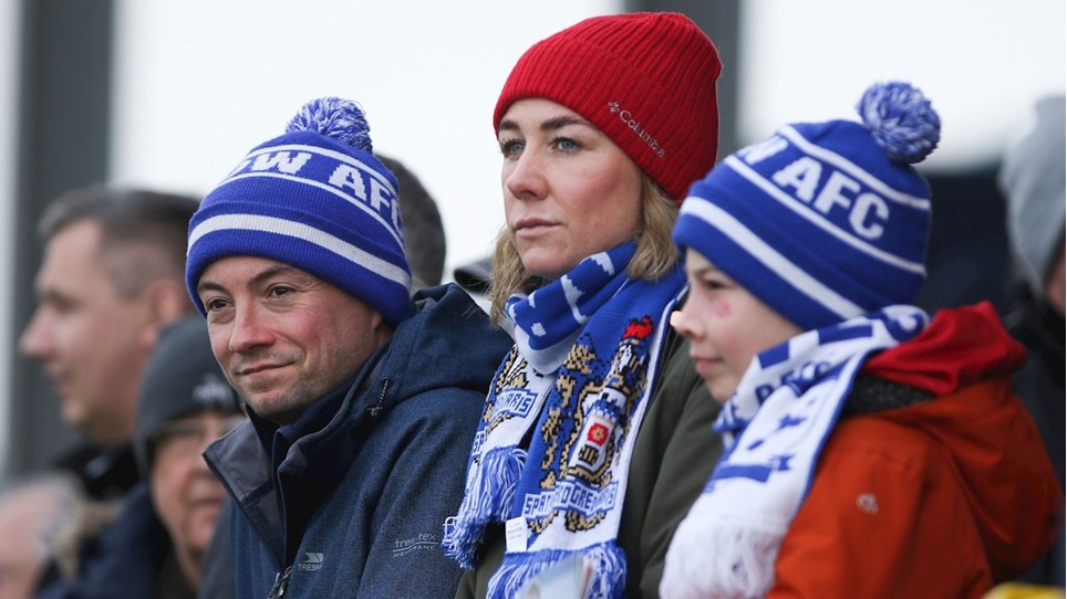 A photograph of Barrow supporters at The Dunes Hotel Stadium