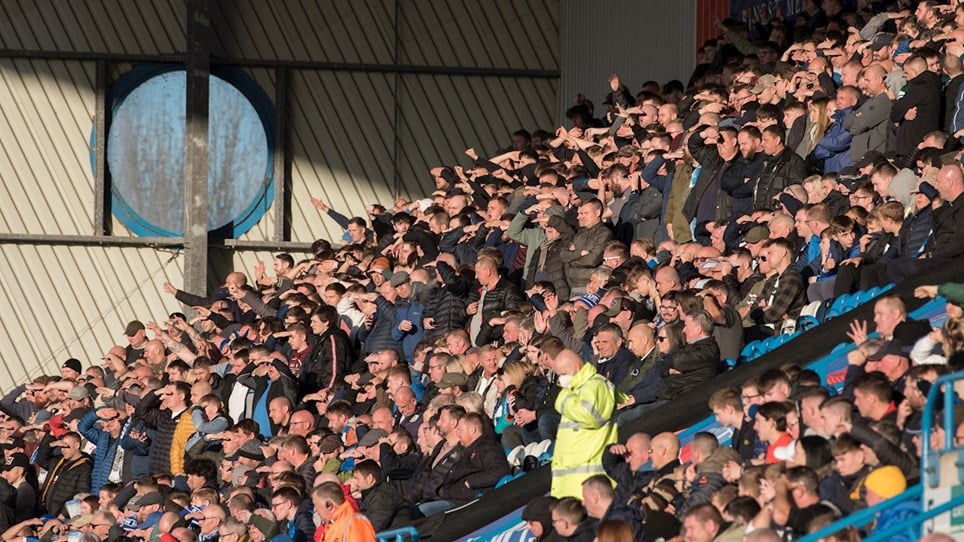 A photograph of Barrow fans at the game against Carlisle United at Brunton Park