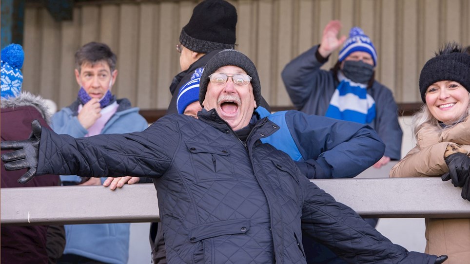 A photograph of Barrow fans at The Dunes Hotel Stadium during the game against Mansfield Town