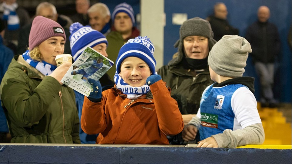 A photograph of Barrow fans at The Dunes Hotel Stadium