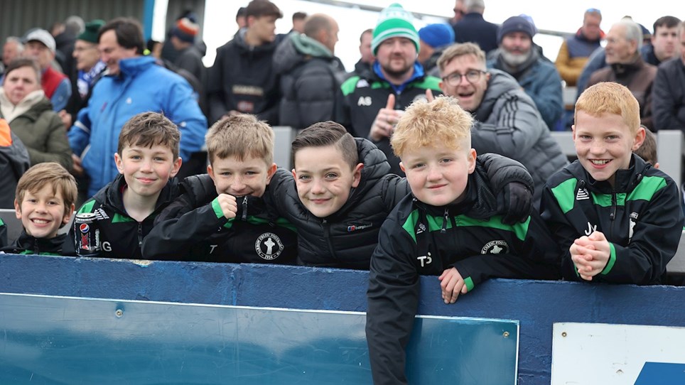 A photograph of young Barrow fans at The Dunes Hotel Stadium