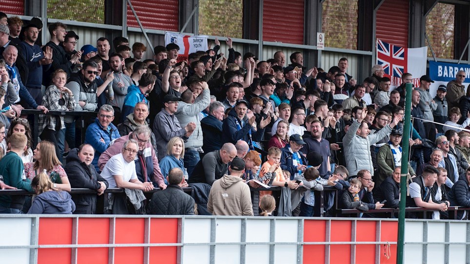 A photograph of Barrow fans at Salford City