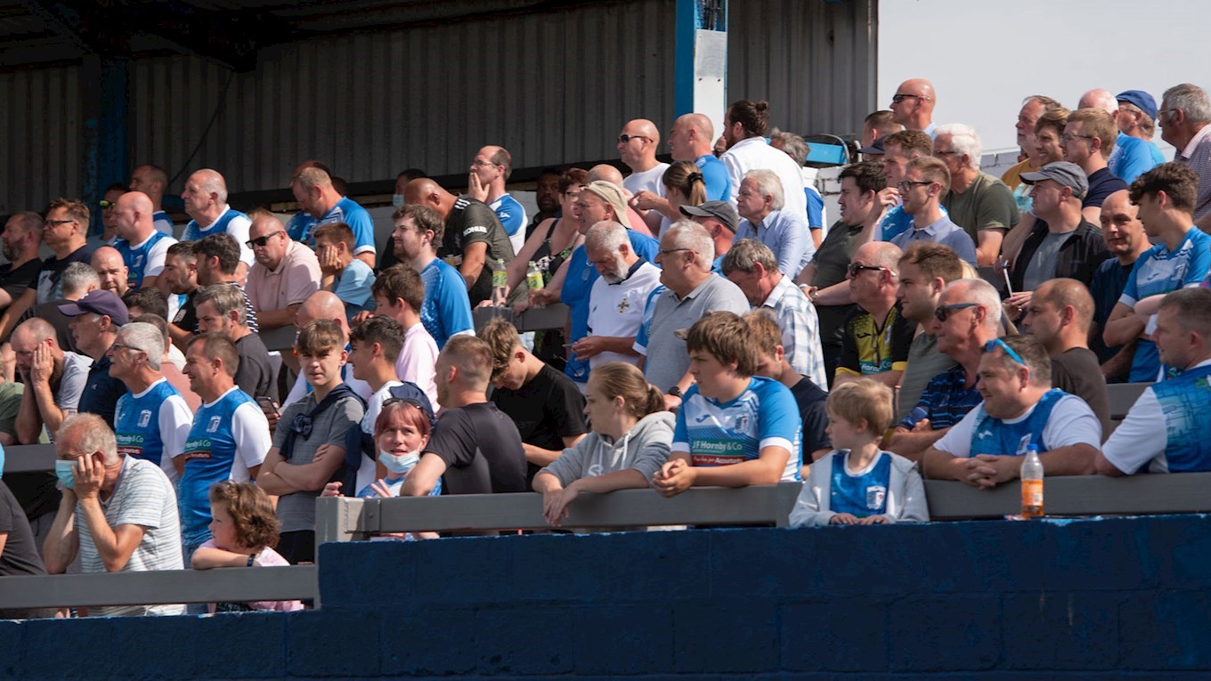 A photograph of Barrow fans at Holker Street