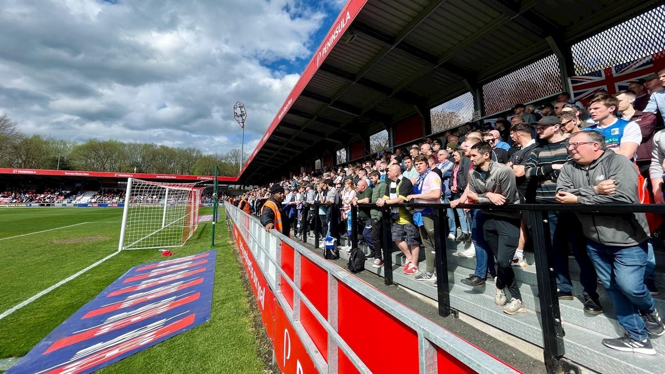 A photograph of Barrow fans at Salford City