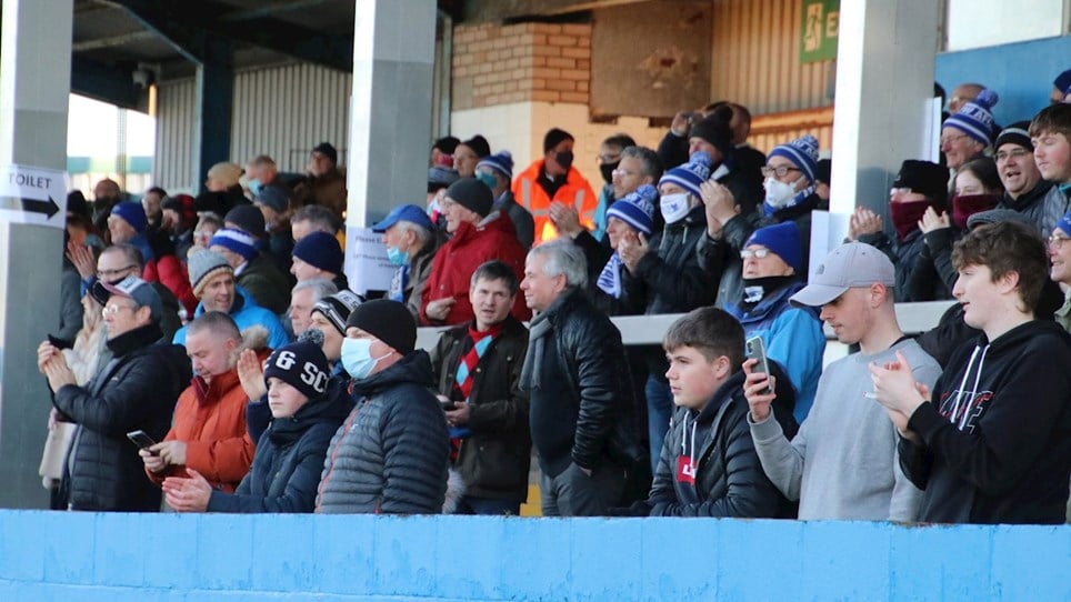 A photograph of Barrow fans at The Progression Solicitors Stadium