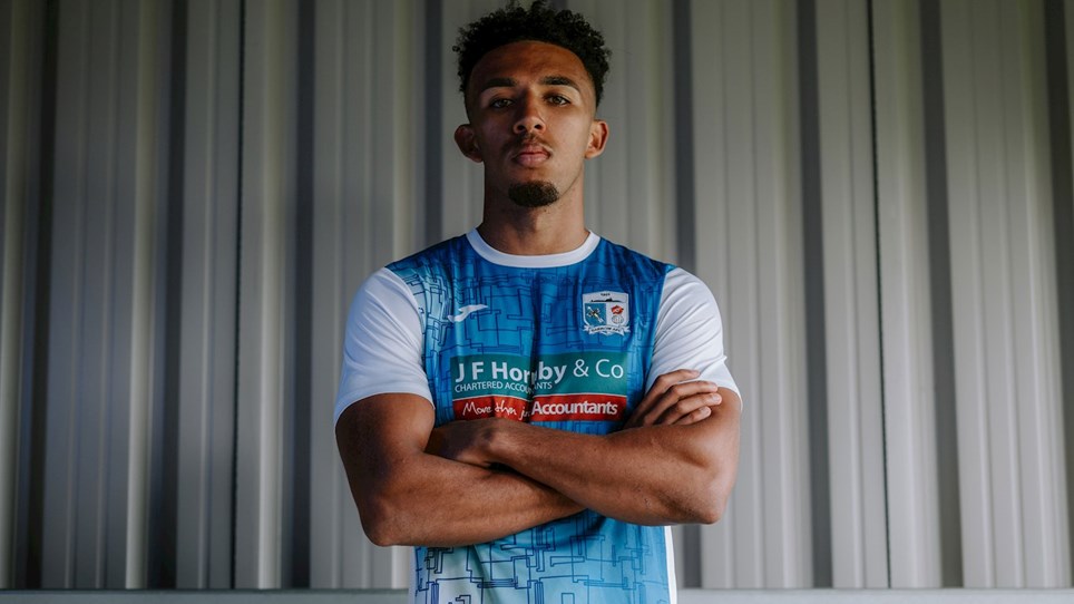 A photograph of Barrow star Remeao Hutton in the new home shirt for 2021/22