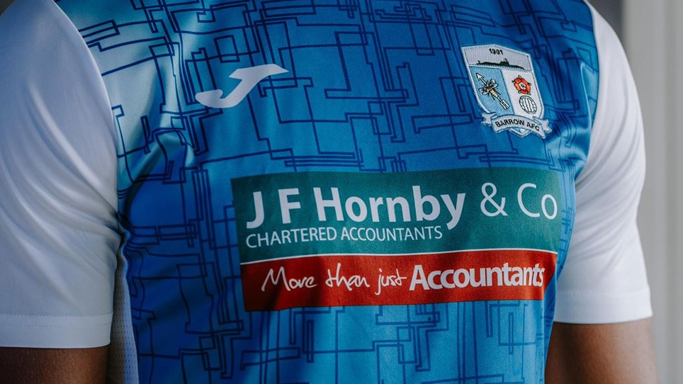 A photograph of the Hornby & Co logo on the Barrow AFC home shirt