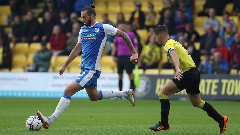 A photograph of Ollie Banks in action for Barrow at Harrogate Town
