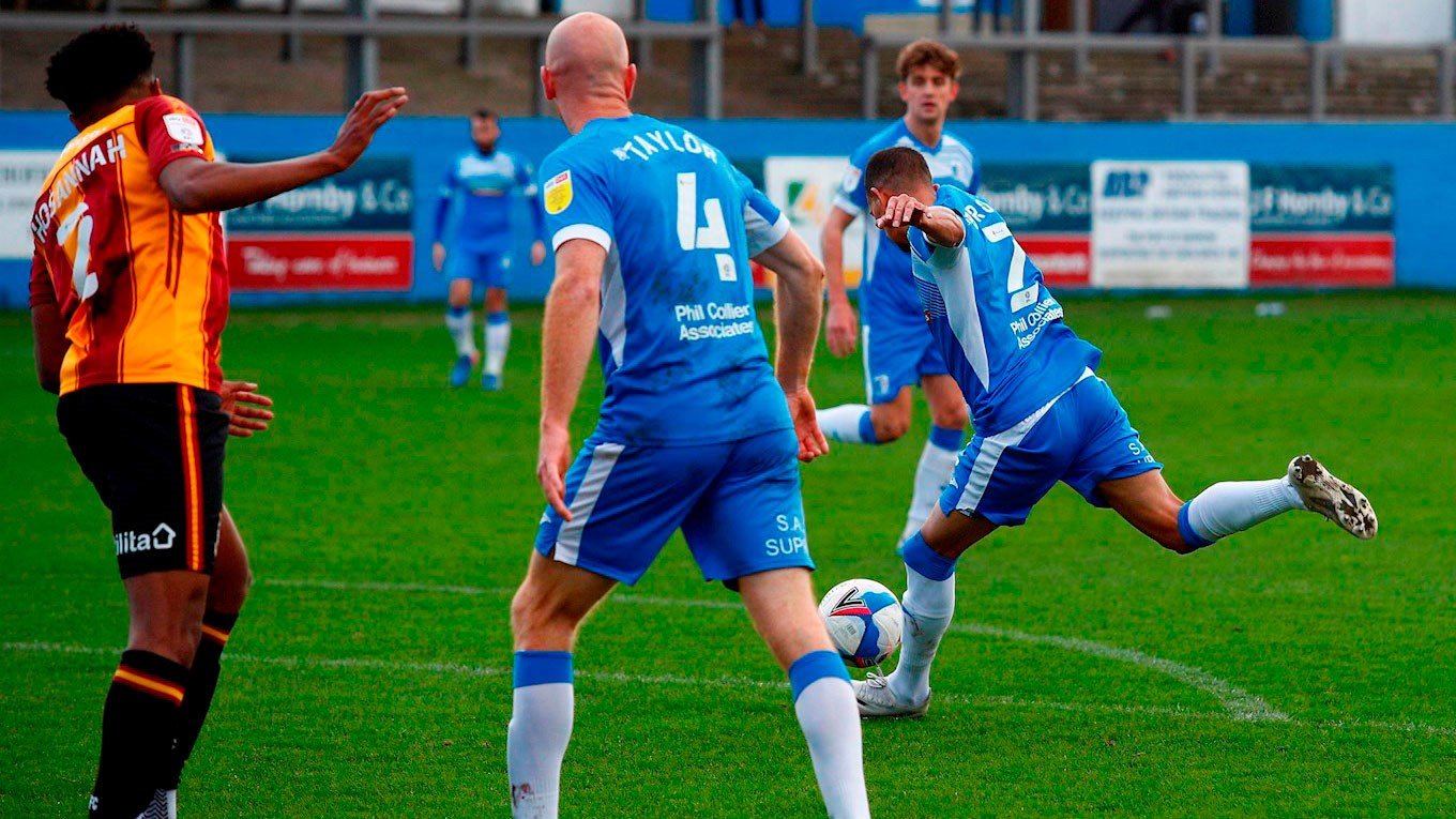 A photograph of Connor Brown scoring for Barrow against Bradford City in 2020/21