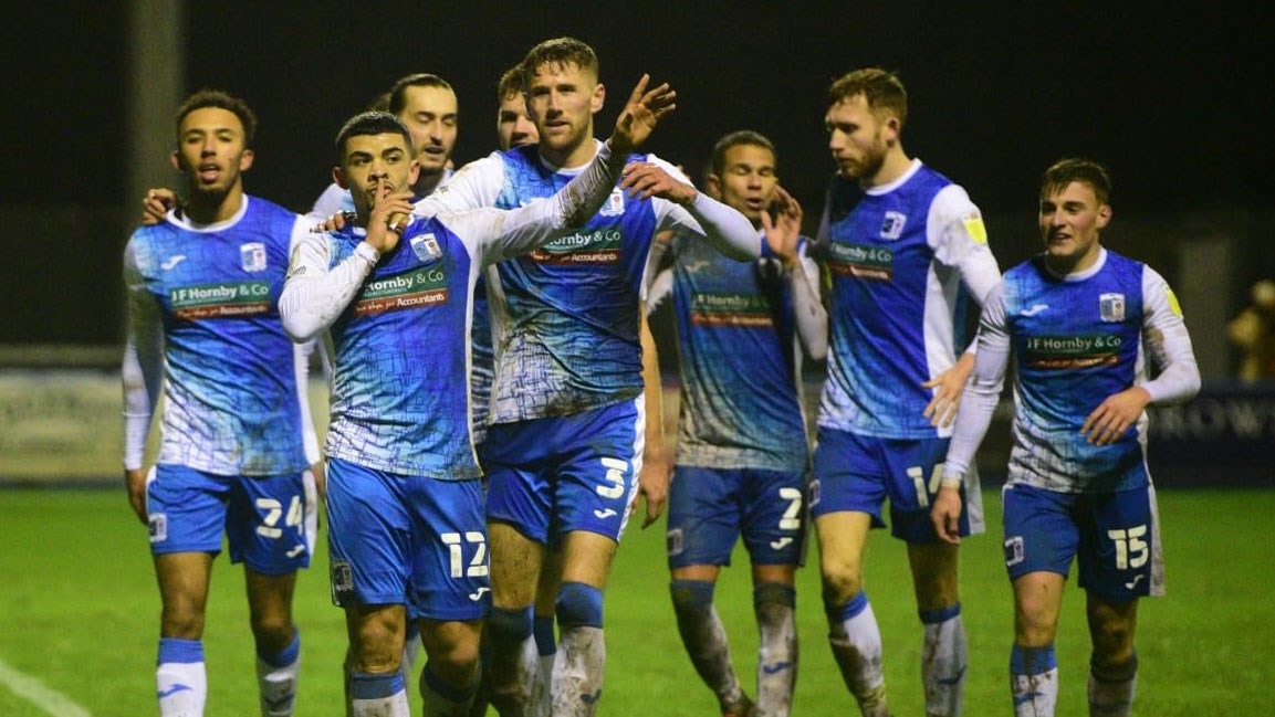 A photograph of Josh Gordon and his Barrow teammates celebrating his goal against Swindon Town