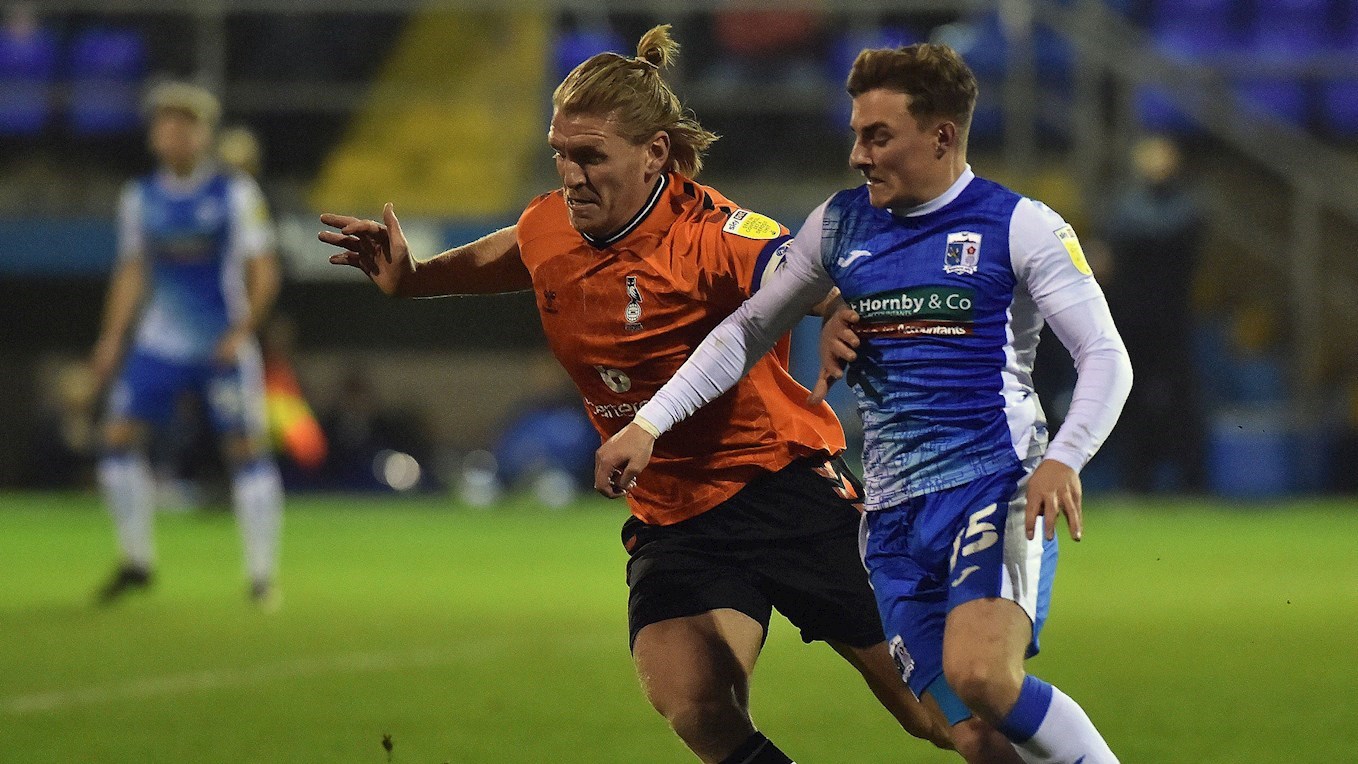 A photograph of Robbie Gotts in action for Barrow against Oldham Athletic