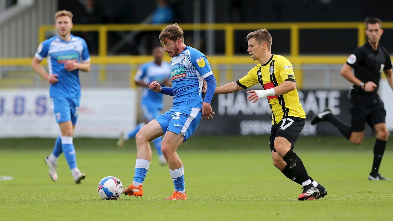 A photograph of Luke James in action for Barrow at Harrogate Town in 2020/21