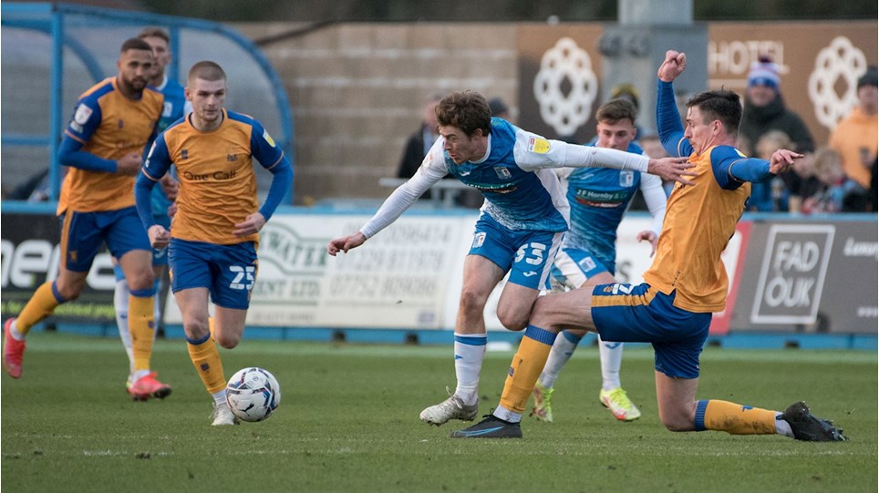 A photograph of Luke James in action for Barrow against Mansfield Town