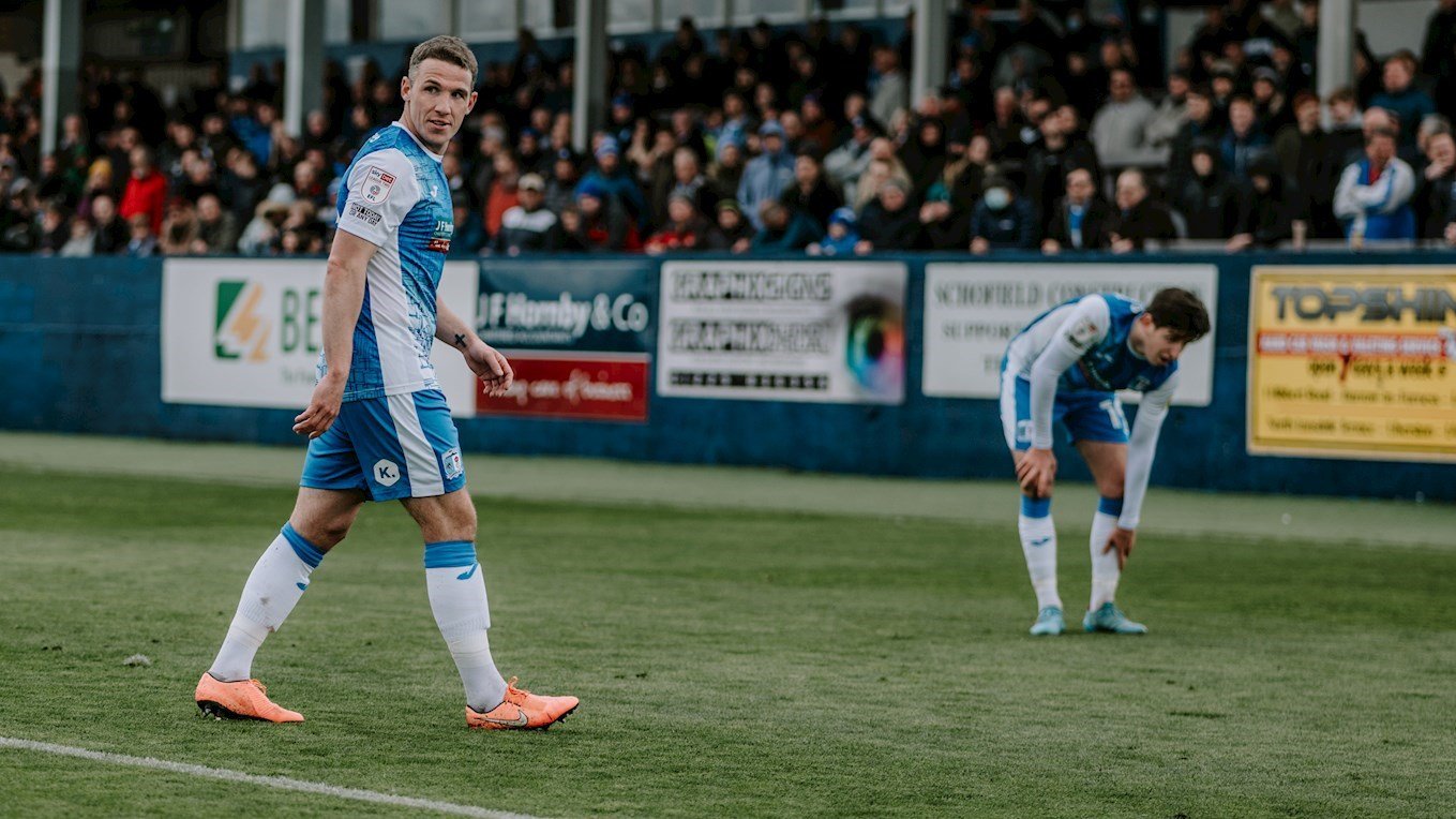 A photograph of John Rooney in action for Barrow against Port Vale