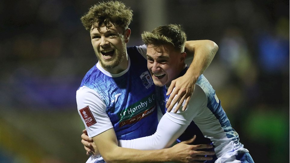 A photograph of Barrow duo Jordan Stevens and Robbie Gotts celebrating the first goal against Ipswich Town