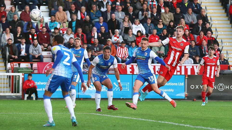 A photograph of Barrow scoring the opening goal of the game at Exeter City