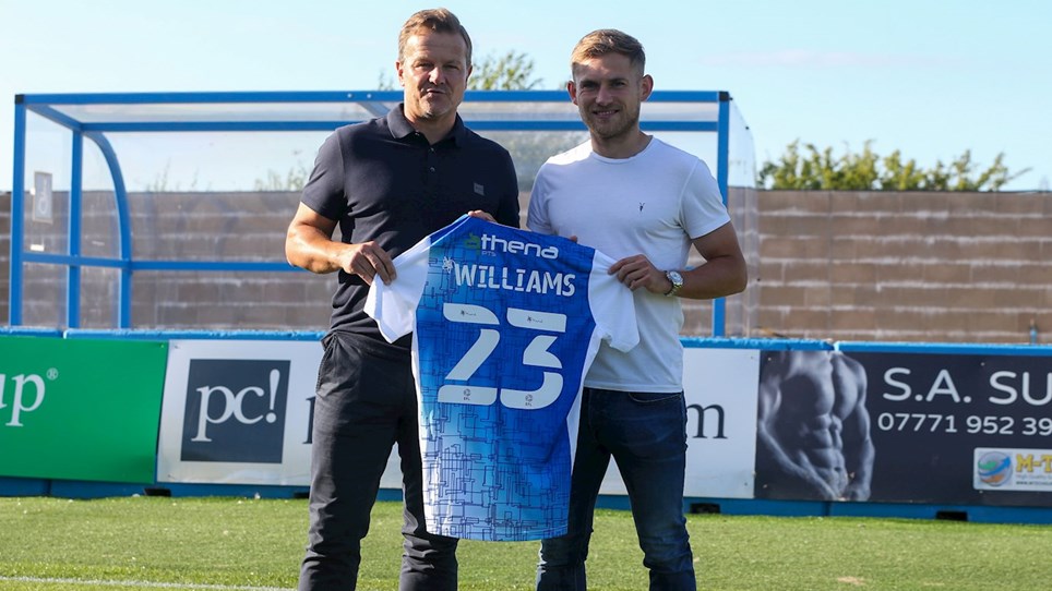 A photograph of Barrow boss Mark Cooper and new signing George Williams
