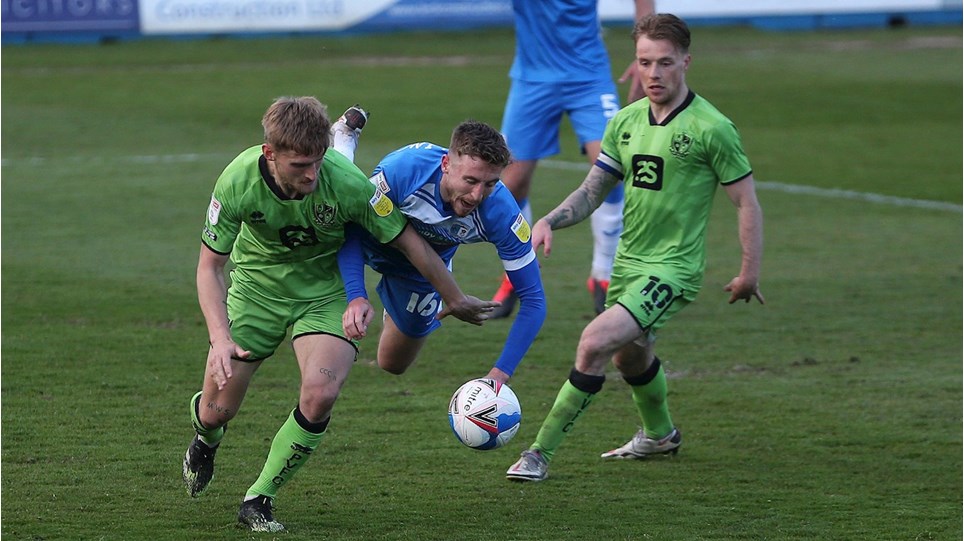 A photograph of Tom Beadling action against Port Vale