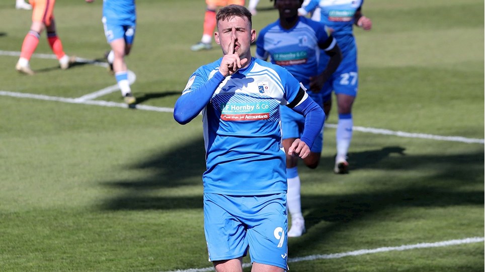 A photograph of Scott Quigley celebrating his goal against Carlisle United