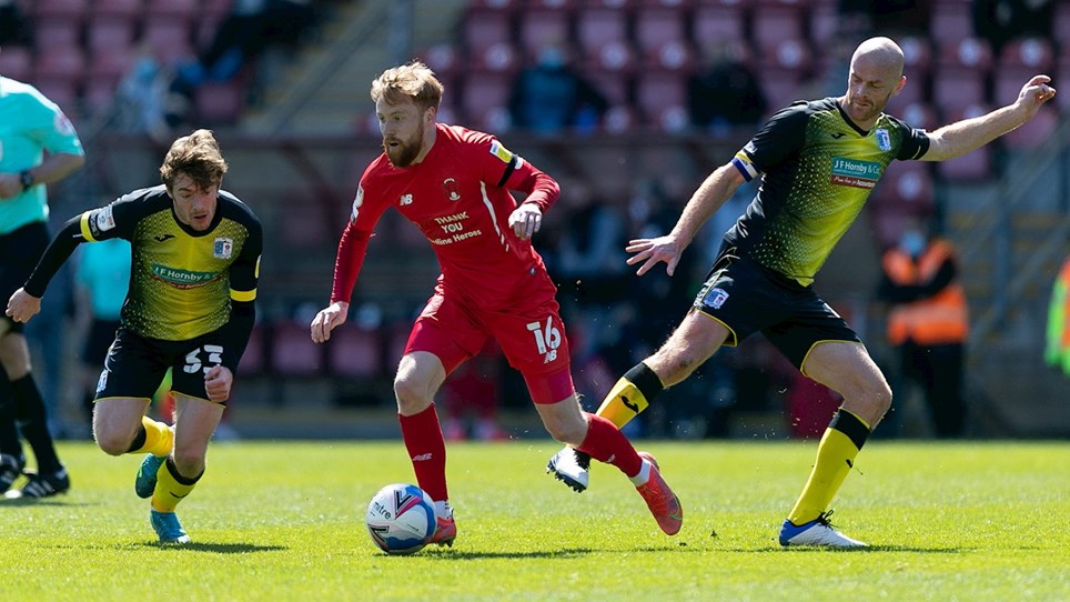 A photograph of Luke James and Jason Taylor in action at Leyton Orient